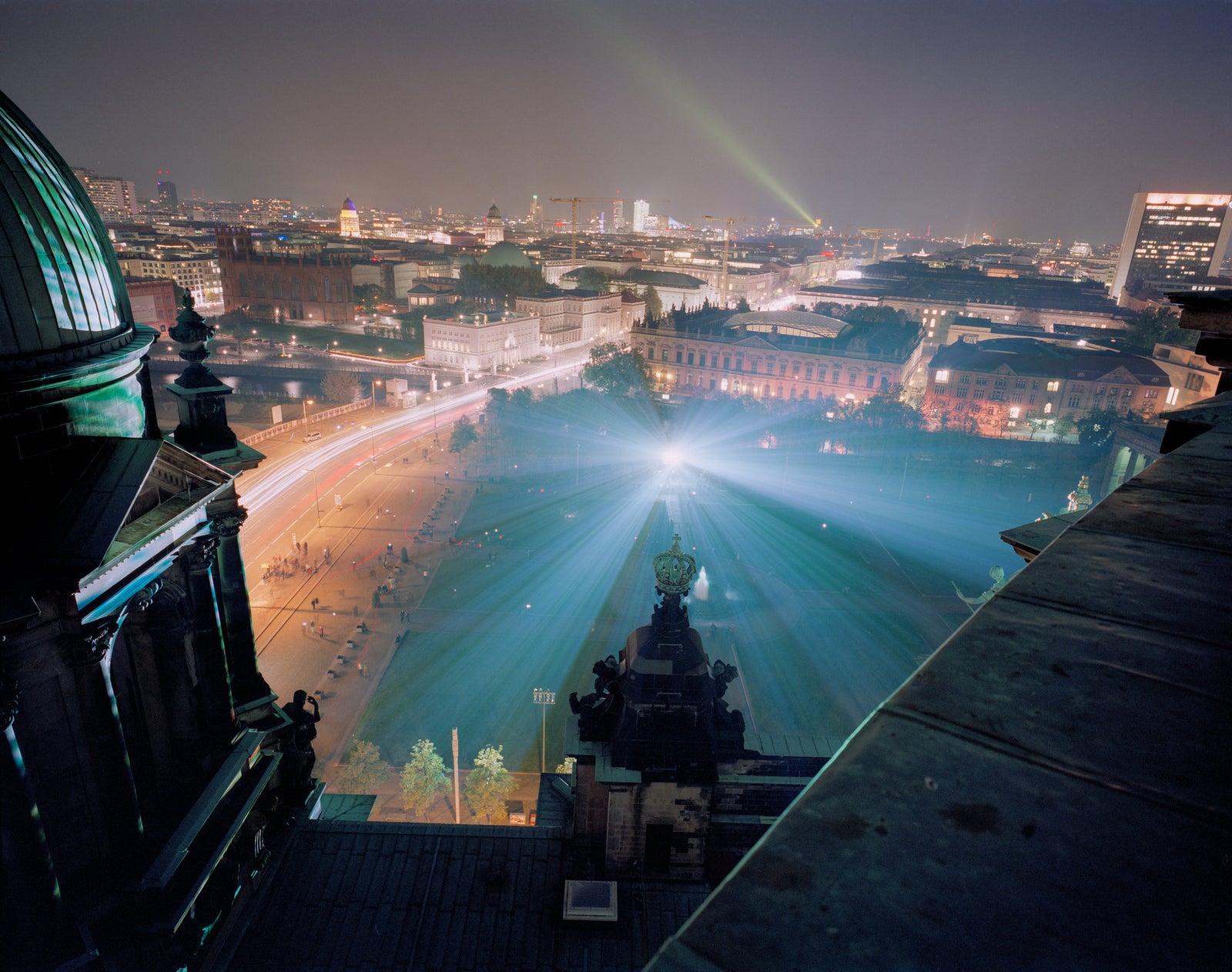 Fine art photography by André Wagner: Dark roof edges frame a broad night city — Berliner Dom VII.