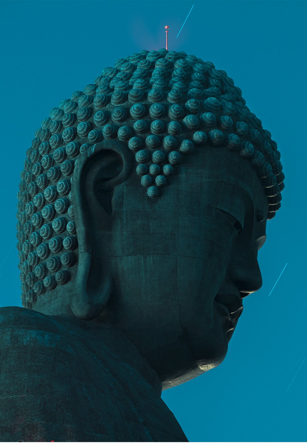 Fine art photography by André Wagner: A large Buddha’s head appears in a close side view against blue sky — Daibutsu head, Japan.