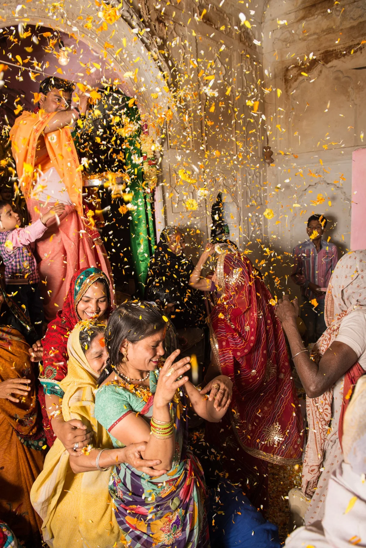 Photograph of a crowd with coloured powder during a celebration