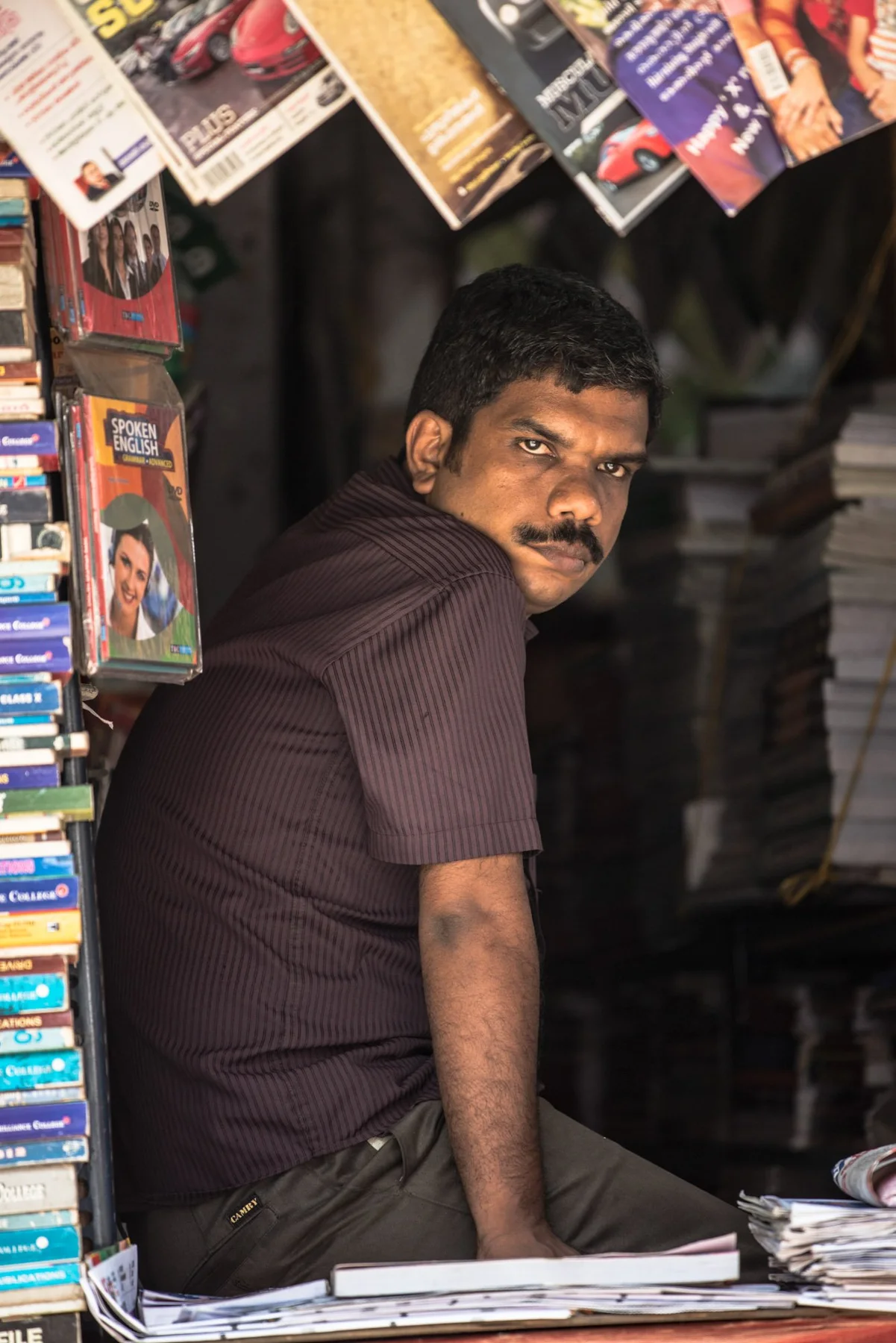 Portrait of a person inside a small shop