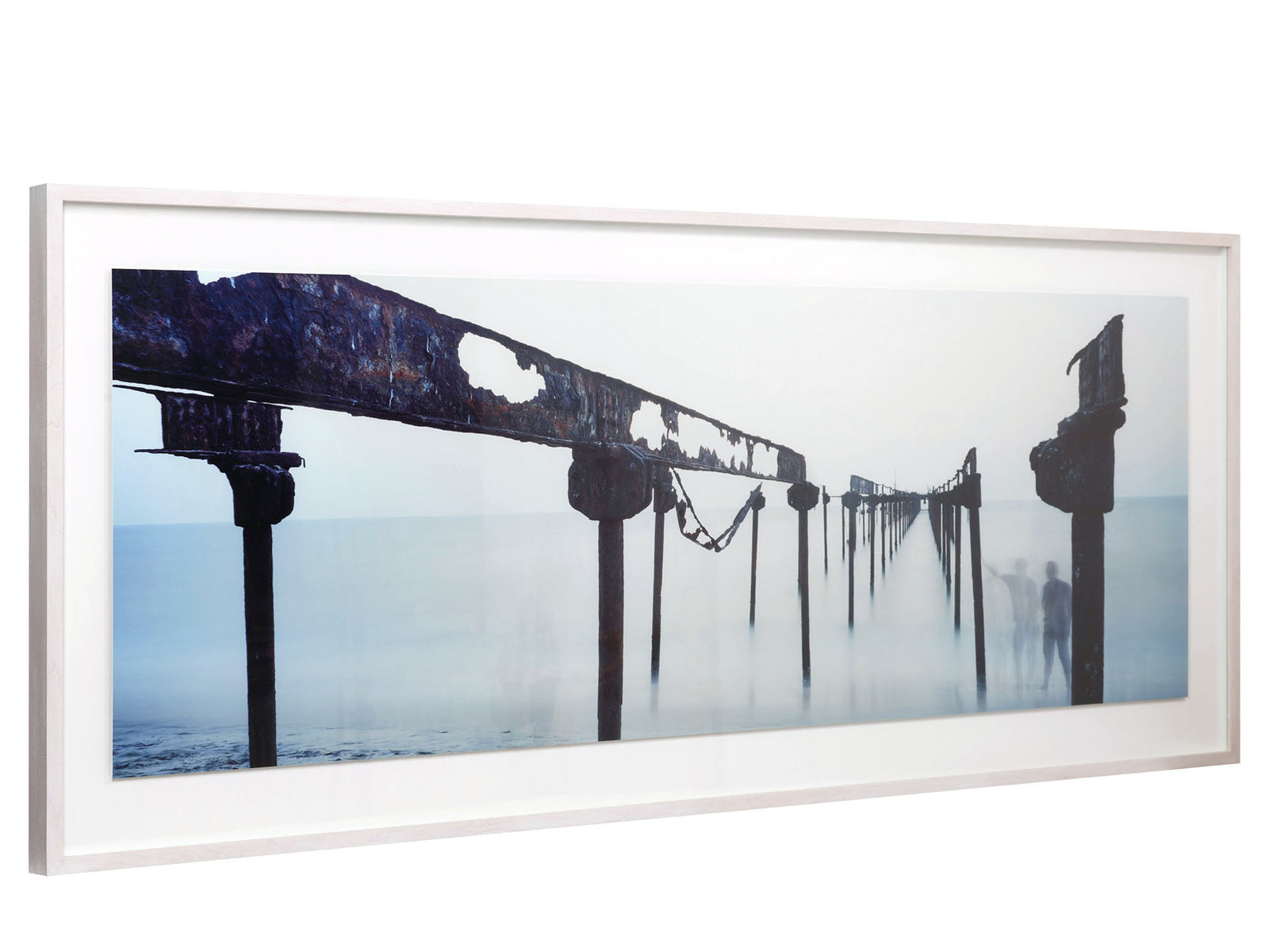 Fine art photography by André Wagner: A broad, perforated iron beam descends from the left edge of the image towards the centre — Rust bridge, Indien.