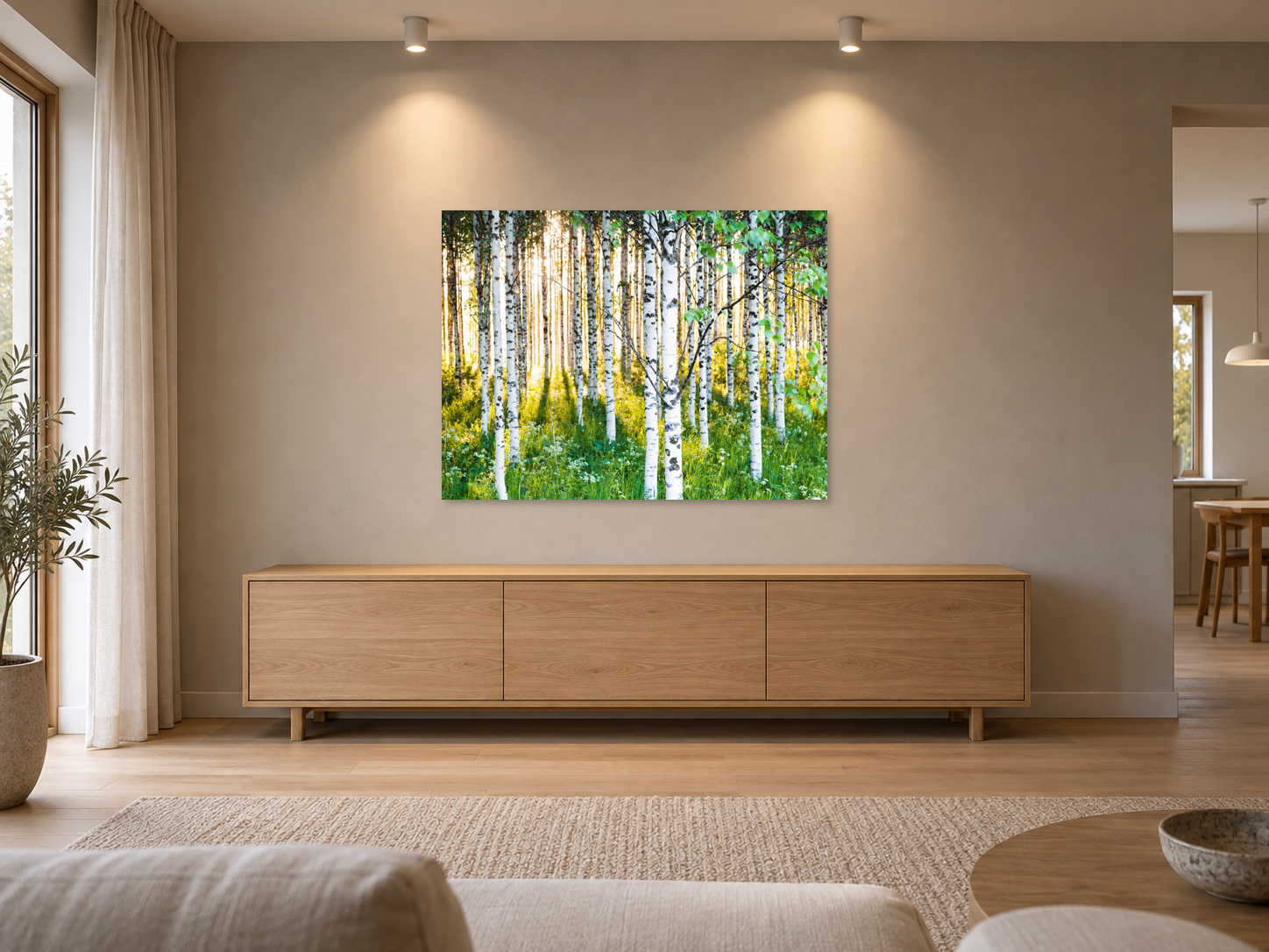 AI-generated room visualisation – ATMOSPHERIC BIRCH FOREST 3, Finland, MATT GLASS. The unchanged original, unframed and wall-mounted above an empty sideboard; diffuse lighting.