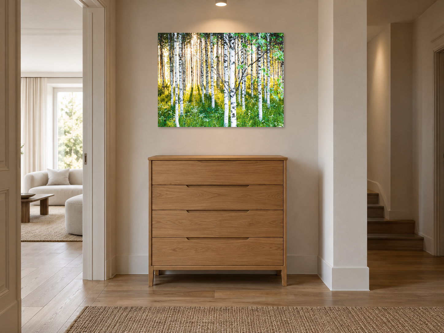 AI-generated room visualisation – ATMOSPHERIC BIRCH FOREST 3, Finland, 81 × 108 cm, MATT GLASS. The unchanged original, unframed and wall-mounted in a hallway niche above a tall, narrow chest; diffuse lighting.